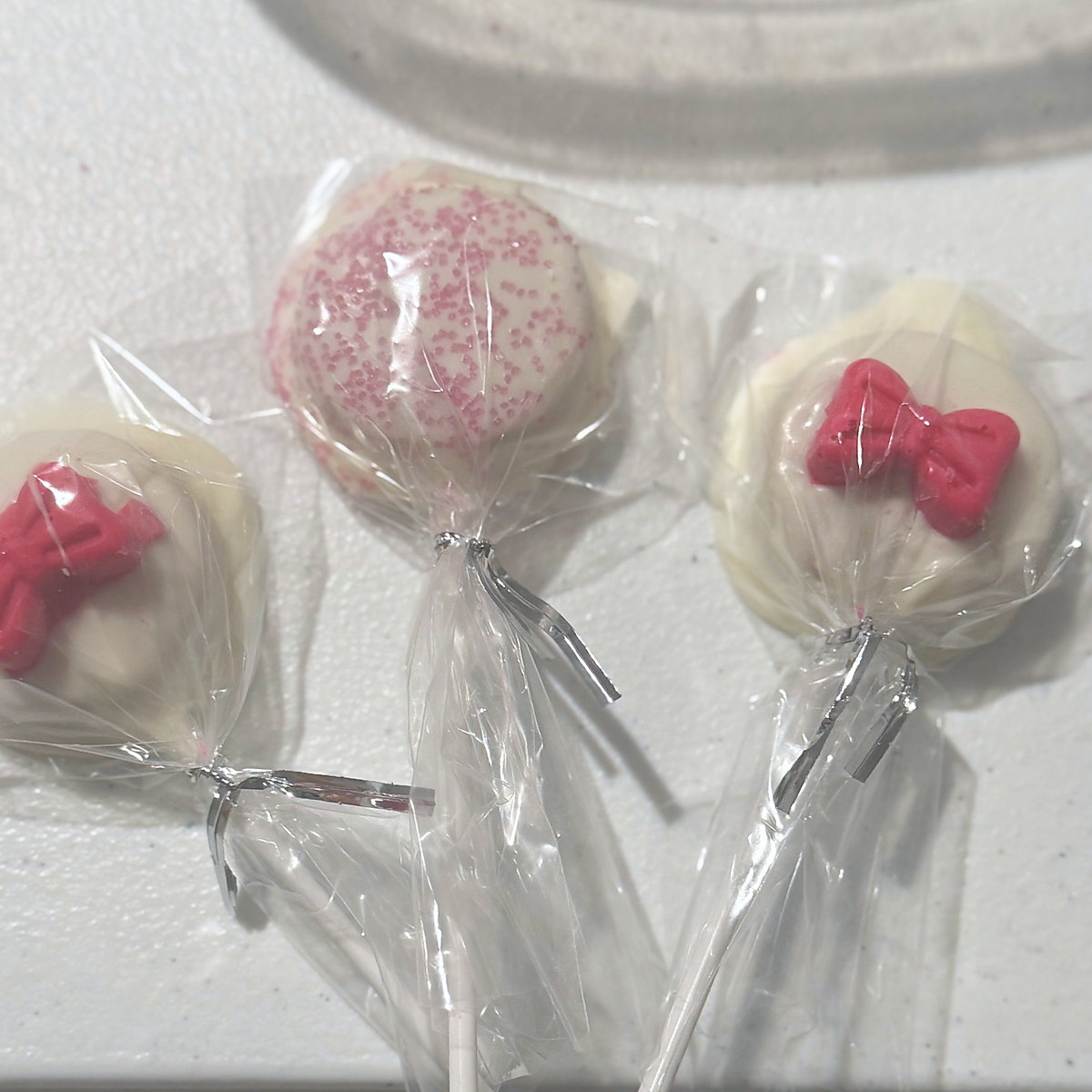 Bow-topped cake pops for a baby shower