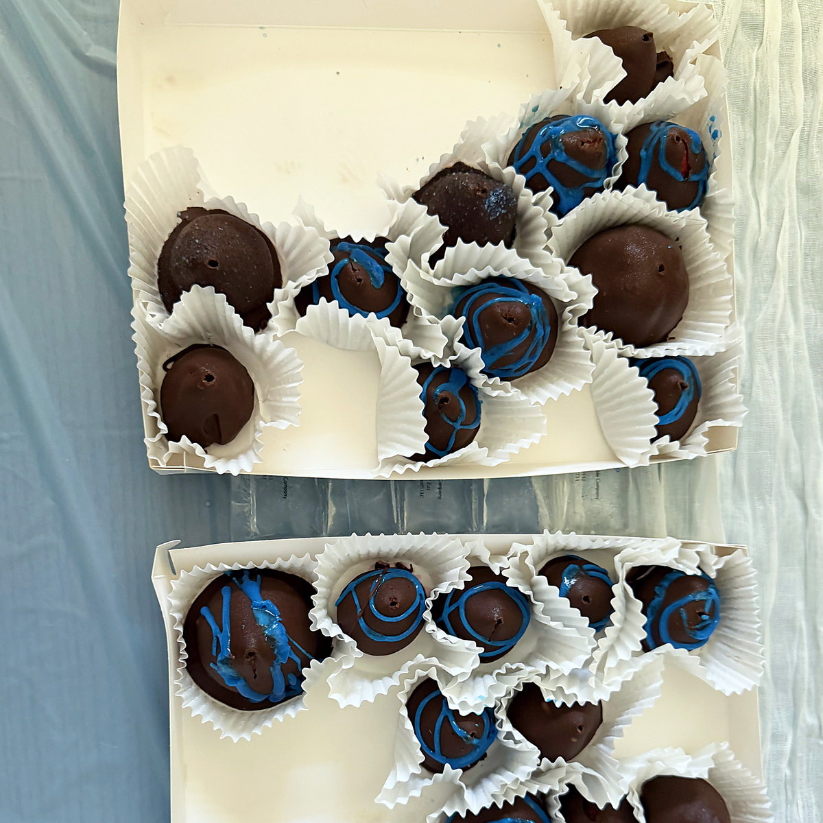 Chocolate-dipped treats boxed for a shower